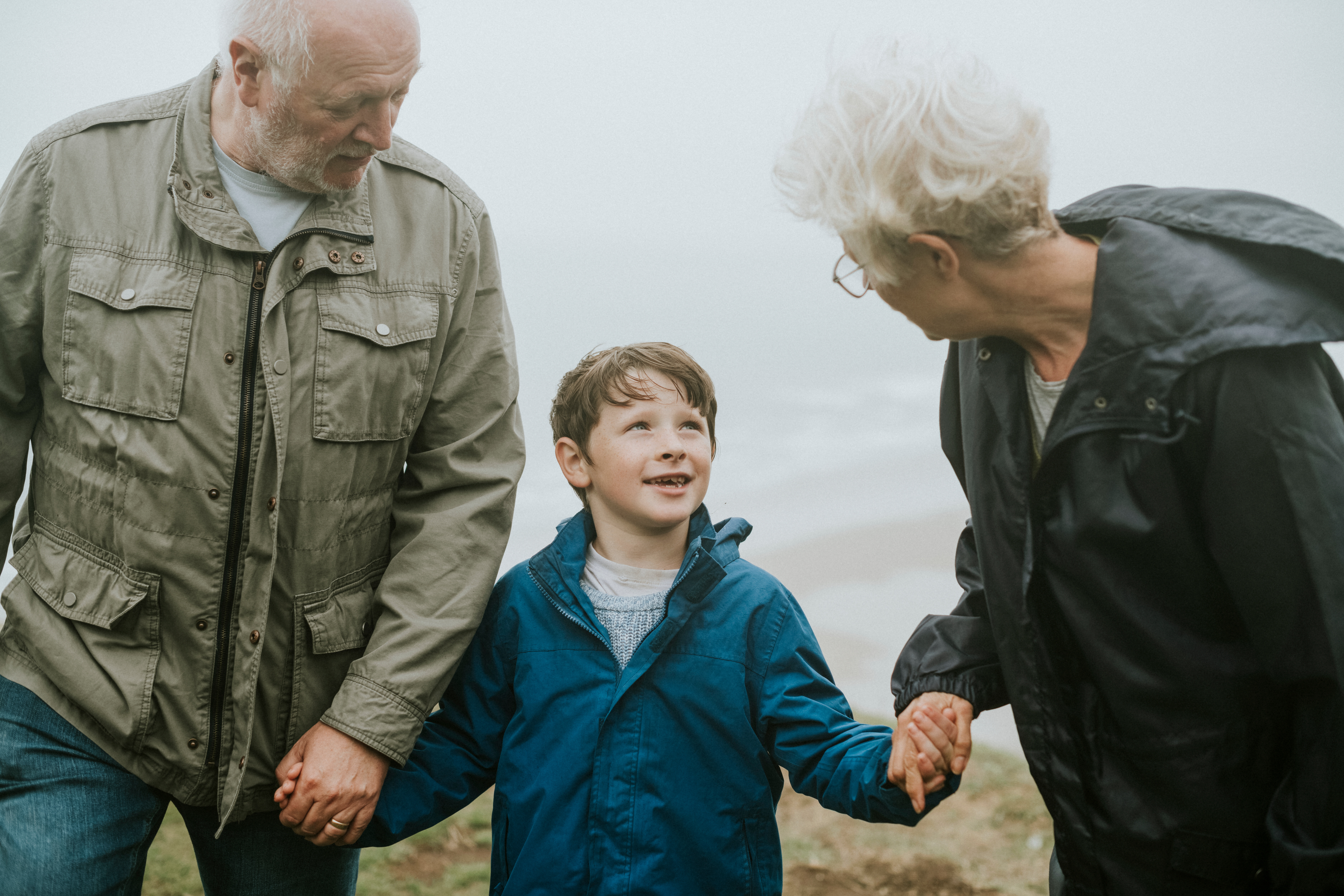 Foster parents talking a child for a walk