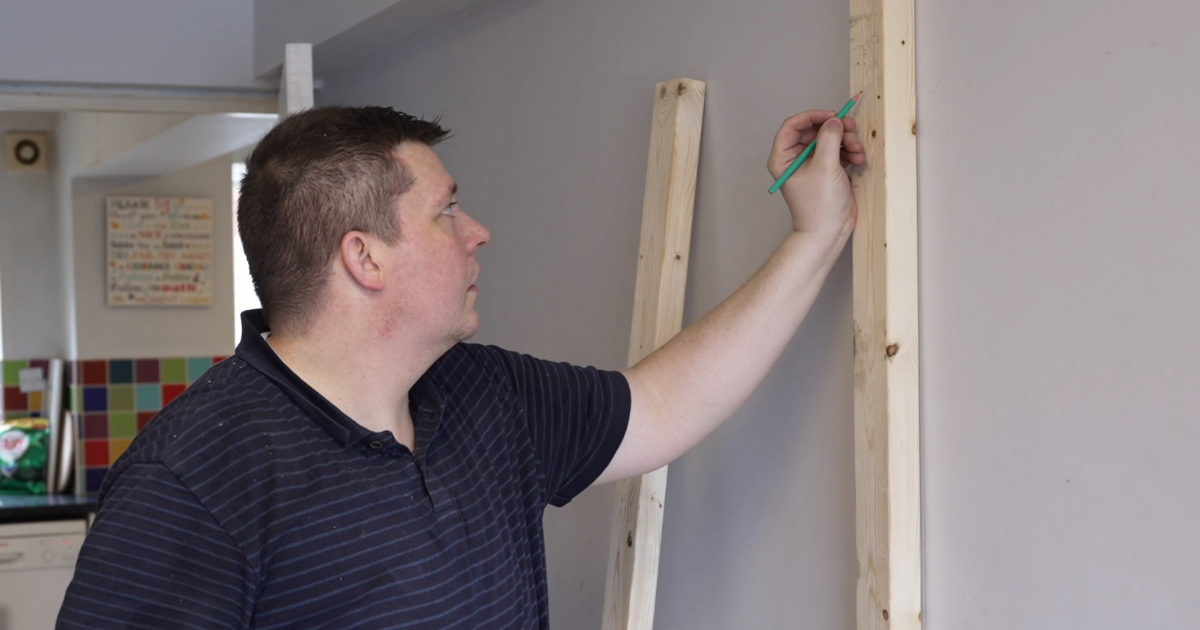 Chris, Tameside Council foster carer decorating a room