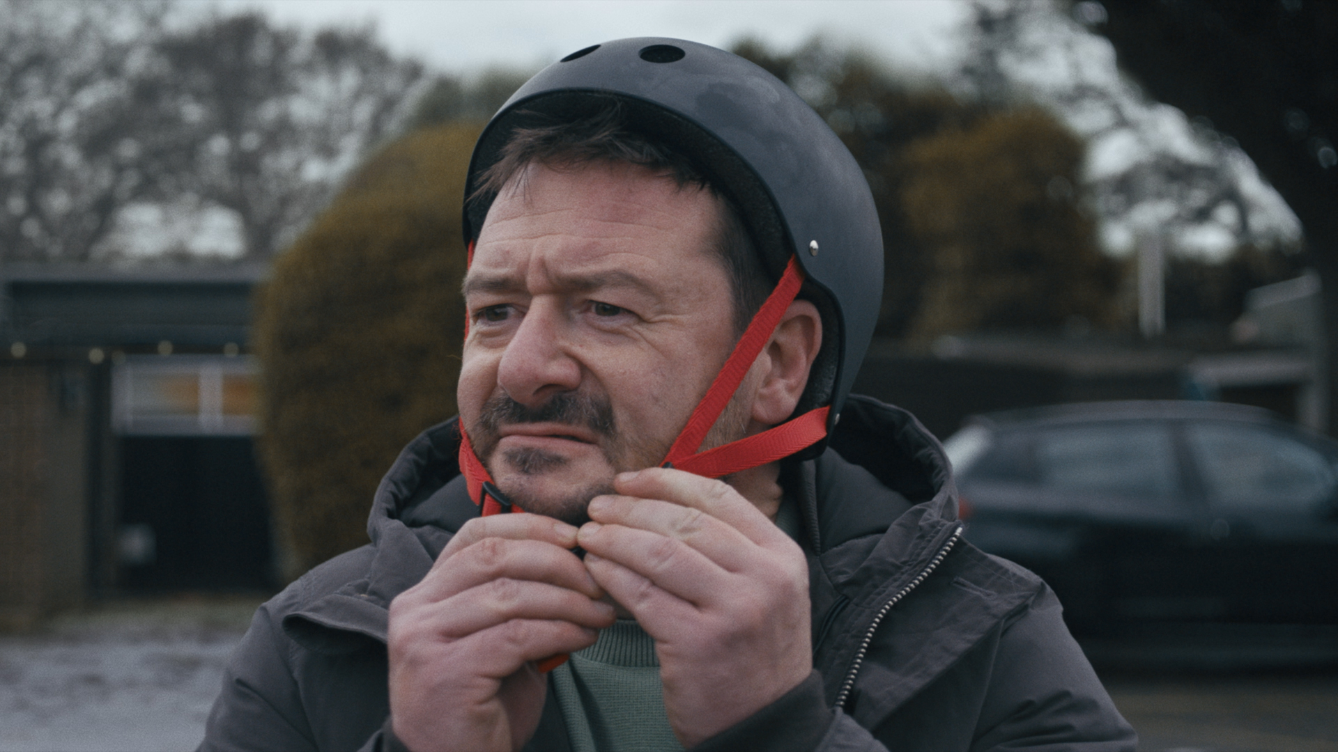 John Lewis Christmas ad, man putting on helmet